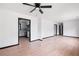 Open living space with view to kitchen and modern ceiling fan at 1463 Rockmoor Ct, Stone Mountain, GA 30088