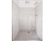 Shower features white tiling and unique hexagon tile flooring at 1463 Rockmoor Ct, Stone Mountain, GA 30088