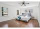 Bright bedroom with hardwood floors, ceiling fan, and lots of natural light from three windows at 335 Amberidge Trl, Sandy Springs, GA 30328