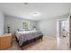 Relaxing bedroom featuring neutral tones, tiled floor, and a side table at 3776 Bromolow Trl, Lawrenceville, GA 30044