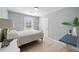 Serene bedroom with tiled floor, natural light, and a simple desk at 3776 Bromolow Trl, Lawrenceville, GA 30044