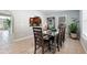 Bright dining room with archway view of kitchen and modern dining table at 3776 Bromolow Trl, Lawrenceville, GA 30044
