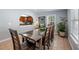 Bright dining room with archway view of kitchen and modern dining table at 3776 Bromolow Trl, Lawrenceville, GA 30044