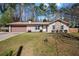 Charming single-story home with a well-manicured lawn, stone accents, and an attached two-car garage at 3776 Bromolow Trl, Lawrenceville, GA 30044