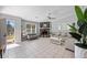 Spacious living room featuring tiled flooring, a stone fireplace, and neutral gray walls for a modern aesthetic at 3776 Bromolow Trl, Lawrenceville, GA 30044