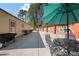 Enjoy outdoor living on this patio featuring an umbrella and seating, a grill, and a colorful painted mural at 3776 Bromolow Trl, Lawrenceville, GA 30044