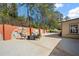 Wide patio with an orange mural retaining wall and outdoor seating area offering room to entertain and relax at 3776 Bromolow Trl, Lawrenceville, GA 30044