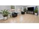 Sitting area featuring tiled flooring, with large windows offering natural light, complemented by indoor plants at 3776 Bromolow Trl, Lawrenceville, GA 30044