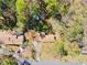 Aerial view of home showcasing roof, driveway, yard, and surrounding trees offering privacy at 5095 Derry Nw Rd, Acworth, GA 30101