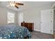 Well-lit bedroom showcases plush carpeting, a traditional dresser, and a comfortable-looking bed at 5095 Derry Nw Rd, Acworth, GA 30101