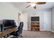 Bedroom featuring a desk area, ceiling fan and window at 5095 Derry Nw Rd, Acworth, GA 30101