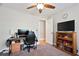 Bedroom featuring a desk area, ceiling fan and window at 5095 Derry Nw Rd, Acworth, GA 30101