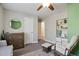Comfortable Bedroom with a changing table, rocking chair, and soft lighting at 5095 Derry Nw Rd, Acworth, GA 30101