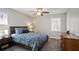 Comfortable bedroom with gray walls, carpet flooring, a ceiling fan and a window at 5095 Derry Nw Rd, Acworth, GA 30101