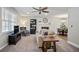 Bright living room featuring a fireplace, dining area, and large window for ample natural light at 5095 Derry Nw Rd, Acworth, GA 30101