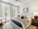 This bedroom features ample natural light, neutral paint, a ceiling fan, and soft textures at 921 Hughley Circle Se # 66, Atlanta, GA 30316