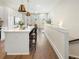 Open-concept kitchen featuring quartz countertops, island seating, and modern stainless appliances at 921 Hughley Circle Se # 66, Atlanta, GA 30316