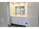Bright bathroom features a double sink vanity with white cabinets and a large mirror at 2664 Mourning Dove Drive( Lot 38), Grayson, GA 30017