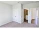 Cozy bedroom with neutral carpet, double closets, and access to a bathroom, offering comfort at 2664 Mourning Dove Drive( Lot 38), Grayson, GA 30017