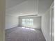 Spacious bedroom with tray ceiling, carpeting, and a window with natural light at 2664 Mourning Dove Drive( Lot 38), Grayson, GA 30017