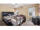 Warm bedroom featuring a cozy crib, double bed, and natural light from the window at 321 Oak Cir, Douglasville, GA 30134