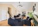 Bright living room featuring vaulted ceilings, hardwood floors, a fireplace, and lots of natural light at 321 Oak Cir, Douglasville, GA 30134