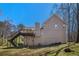 This backyard is highlighted by a large back deck and mature trees at 321 Oak Landing Cir, Douglasville, GA 30134