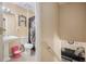 Traditional bathroom features a pedestal sink, toilet, and decorative shower curtain at 321 Oak Landing Cir, Douglasville, GA 30134