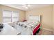 Cozy bedroom featuring a window with blinds, ceiling fan and comfortable single bed at 321 Oak Landing Cir, Douglasville, GA 30134
