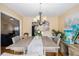 This spacious dining room features an elegant chandelier and decor at 321 Oak Landing Cir, Douglasville, GA 30134