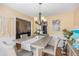 This spacious dining room features an elegant chandelier and decor at 321 Oak Landing Cir, Douglasville, GA 30134