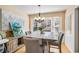This spacious dining room features an elegant chandelier, bay window, and decor at 321 Oak Landing Cir, Douglasville, GA 30134