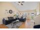 Bright living room features hardwood floors, vaulted ceilings, comfortable sofas, and a view of the outdoors at 321 Oak Landing Cir, Douglasville, GA 30134
