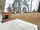 Large backyard with a wood fence and patio provides space for outdoor living and entertaining at 5425 Rock Place Ct # 37, Norcross, GA 30093