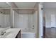 Bathroom features a tub-shower combination and a vanity with a large mirror at 657 Kenridge Dr, Suwanee, GA 30024