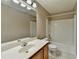 Standard full bathroom featuring a tub and shower, with wood cabinets and tile flooring at 657 Kenridge Dr, Suwanee, GA 30024