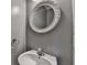 Charming half-bathroom with ornate mirror and sink at 657 Kenridge Dr, Suwanee, GA 30024
