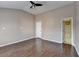 Spacious bedroom with wood flooring and ensuite bathroom at 657 Kenridge Dr, Suwanee, GA 30024