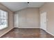 Bright bedroom with wood floors, large window, and ample closet space at 657 Kenridge Dr, Suwanee, GA 30024