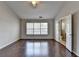Bedroom boasts wood floors, large windows, and an ensuite bathroom at 657 Kenridge Dr, Suwanee, GA 30024