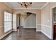 A view of the dining room featuring hard wood floors, natural light, and neutral-colored walls at 657 Kenridge Dr, Suwanee, GA 30024