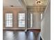 A view of the entryway featuring hard wood floors, natural light, and neutral-colored walls at 657 Kenridge Dr, Suwanee, GA 30024
