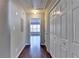 A view of the hallway featuring hard wood floors, multiple closets, and neutral-colored walls at 657 Kenridge Dr, Suwanee, GA 30024