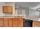 Well-lit kitchen with sleek countertops, stainless steel sink, and ample cabinet space at 657 Kenridge Dr, Suwanee, GA 30024