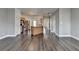 Spacious living area with hardwood floors, light-colored cabinets, stainless appliances and a central island at 657 Kenridge Dr, Suwanee, GA 30024