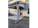 Covered back patio with ceiling fan, concrete floor, and downspout at 740 Great Oak Pl, Villa Rica, GA 30180
