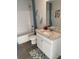 Bathroom featuring a single sink vanity and bathtub with shower at 740 Great Oak Pl, Villa Rica, GA 30180