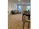 Spacious bonus room featuring a plush gray sofa and a foosball table for entertainment at 740 Great Oak Pl, Villa Rica, GA 30180