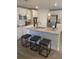 Kitchen island with bar seating and stainless steel appliances at 740 Great Oak Pl, Villa Rica, GA 30180