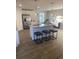 Open kitchen and dining area featuring a large island with bar stools at 740 Great Oak Pl, Villa Rica, GA 30180